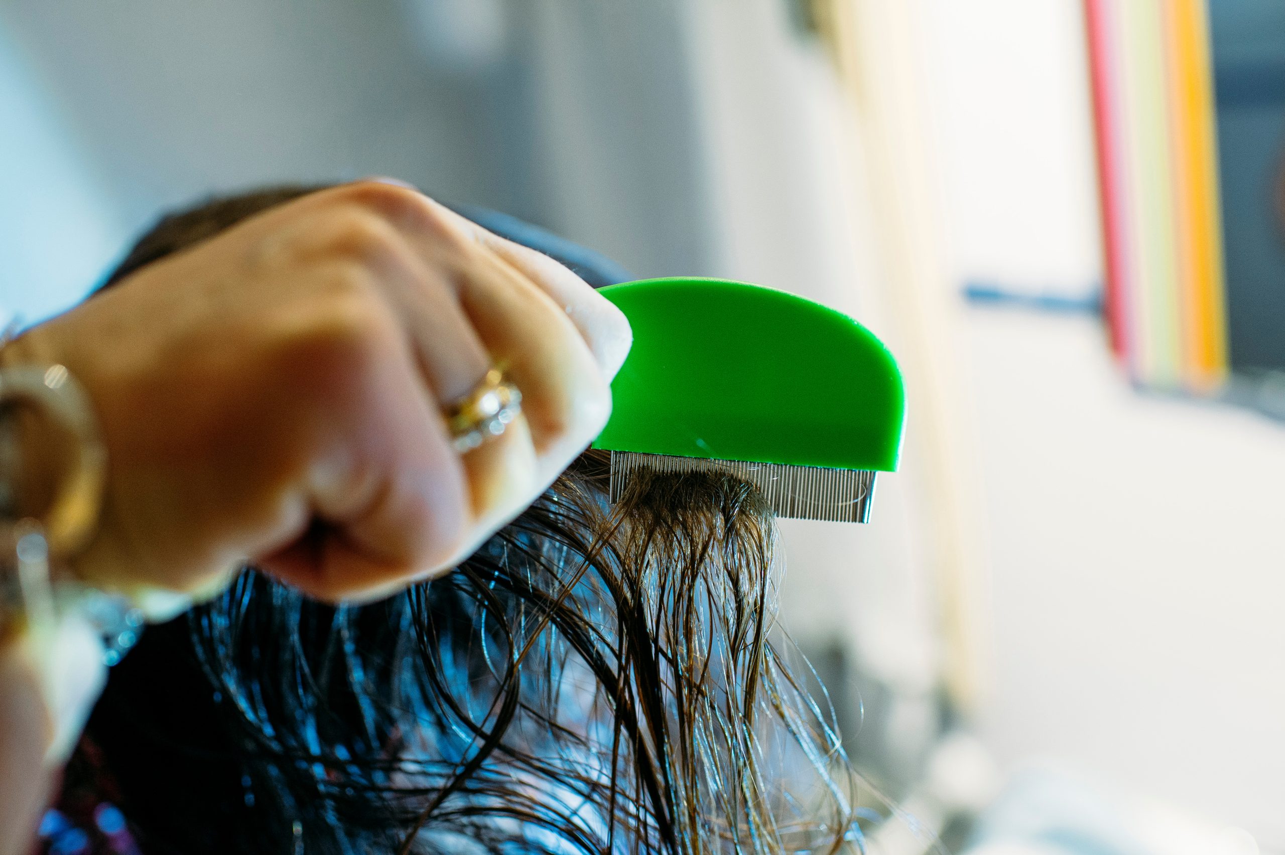 .Mother Checking Daughters Hair For Head Louse