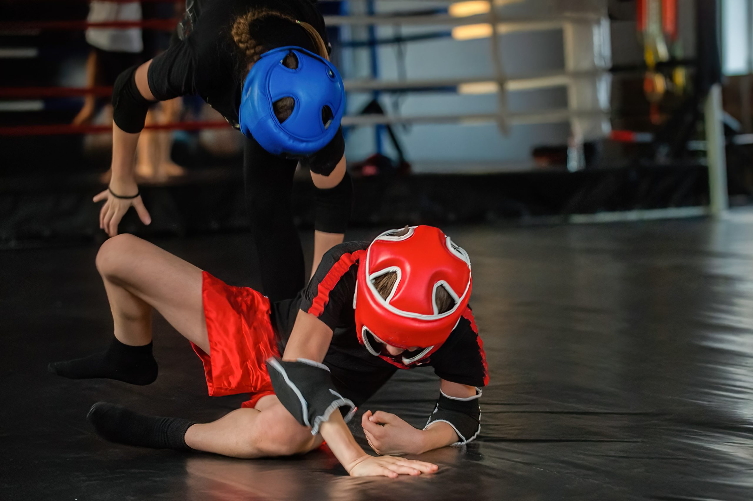 Children in protective sports headgear during close-contact practice